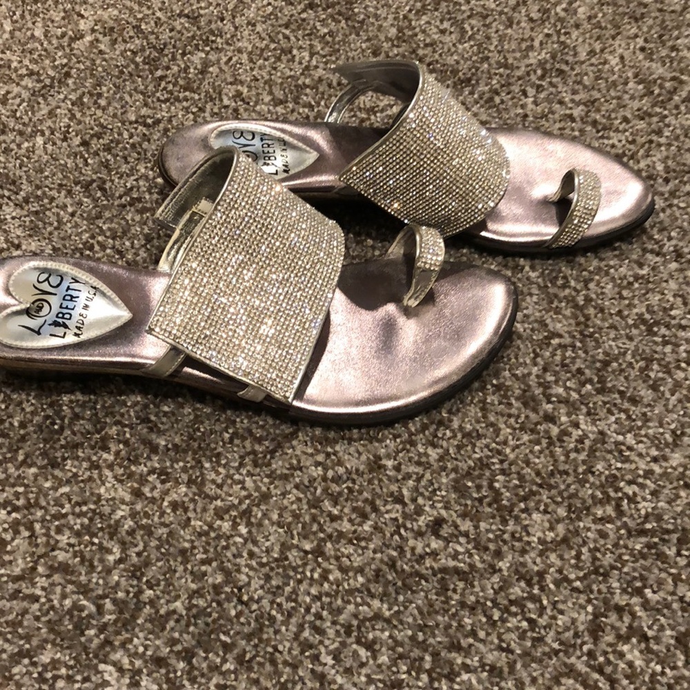 Silver sandal with slight heel.